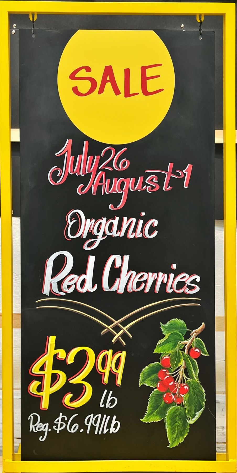 Organic red cherries promotional chalkboard