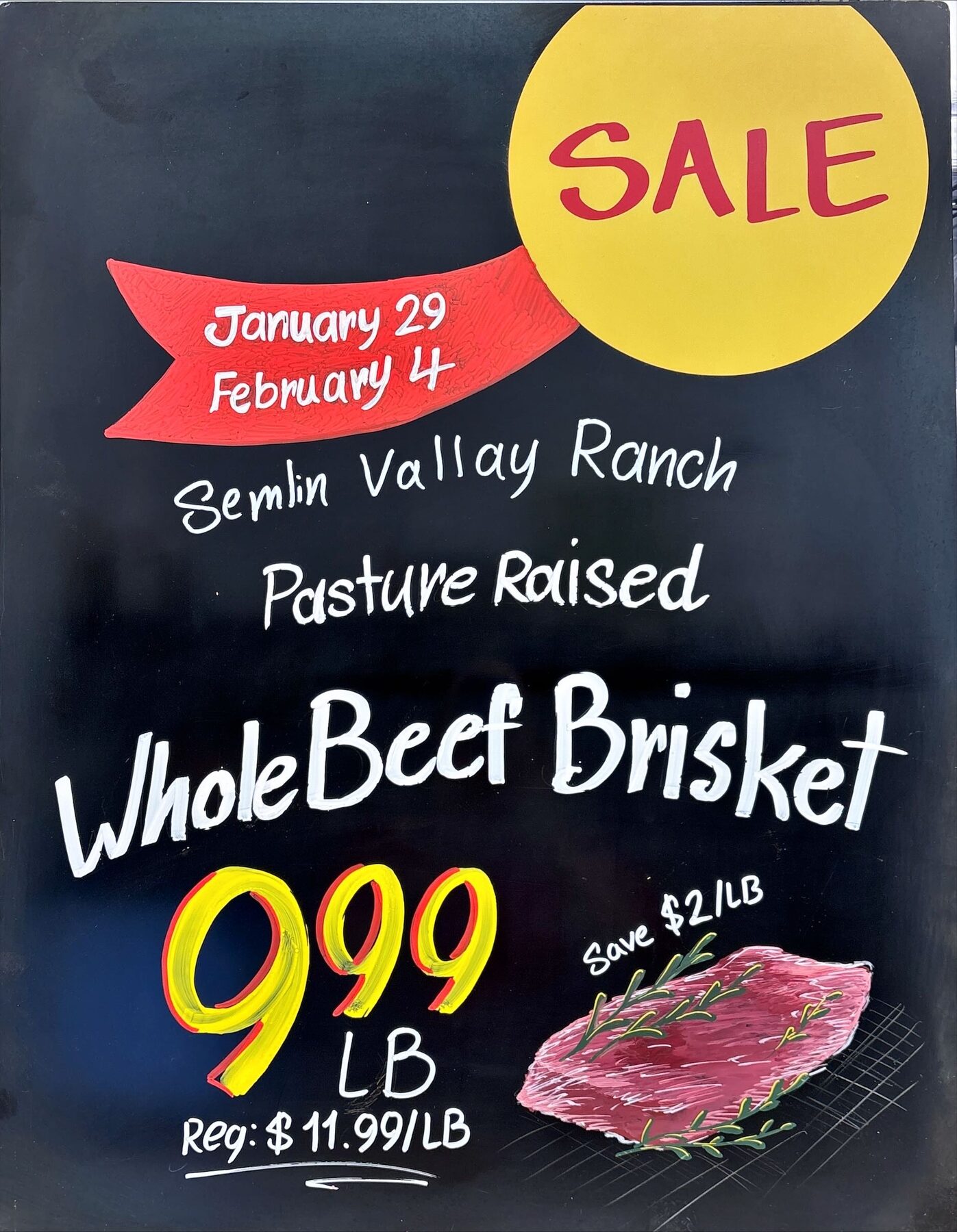 Whole beef brisket hand-lettered promotional chalkboard