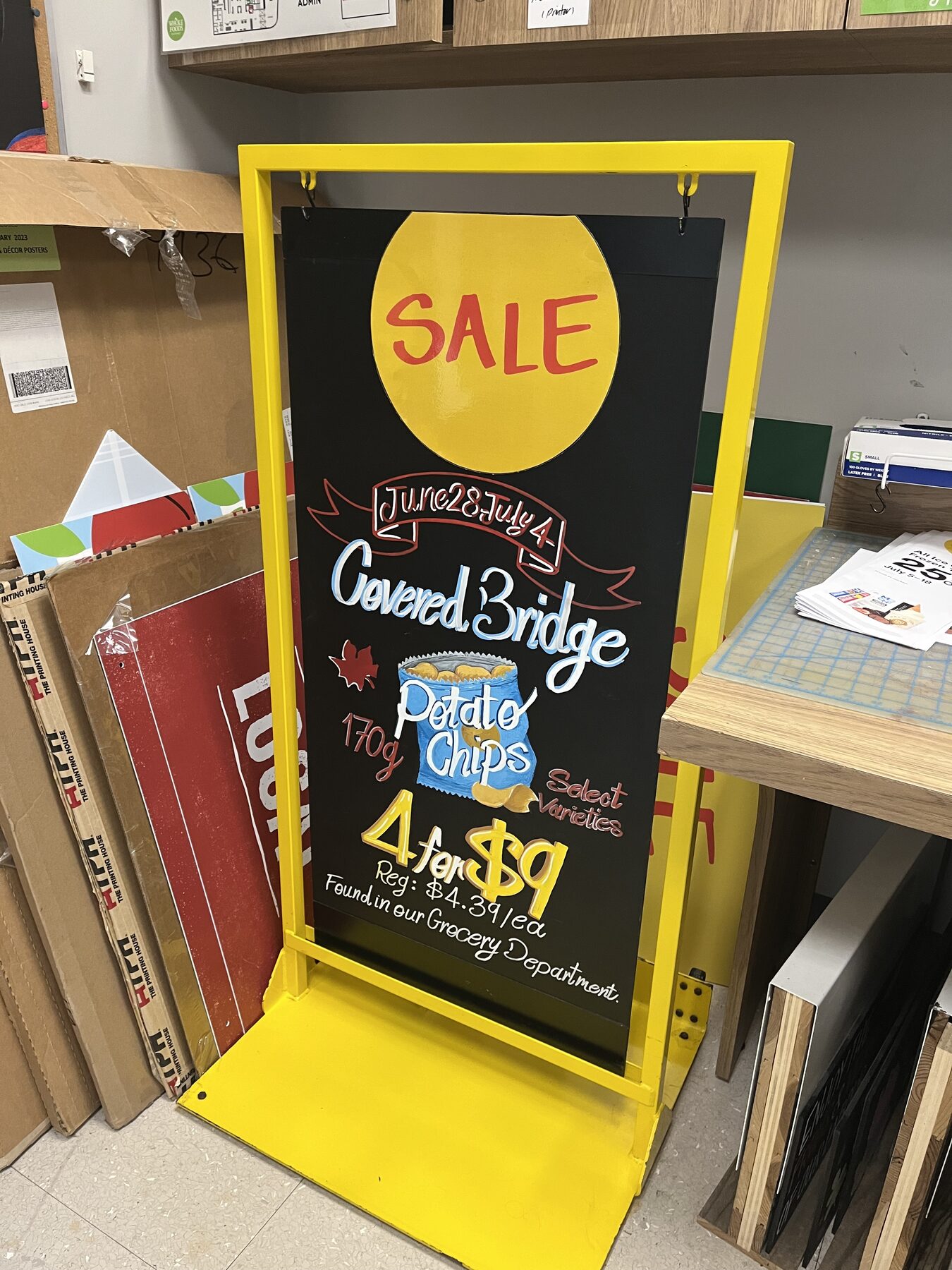 Covered Bridge chips promotional board shown in store context