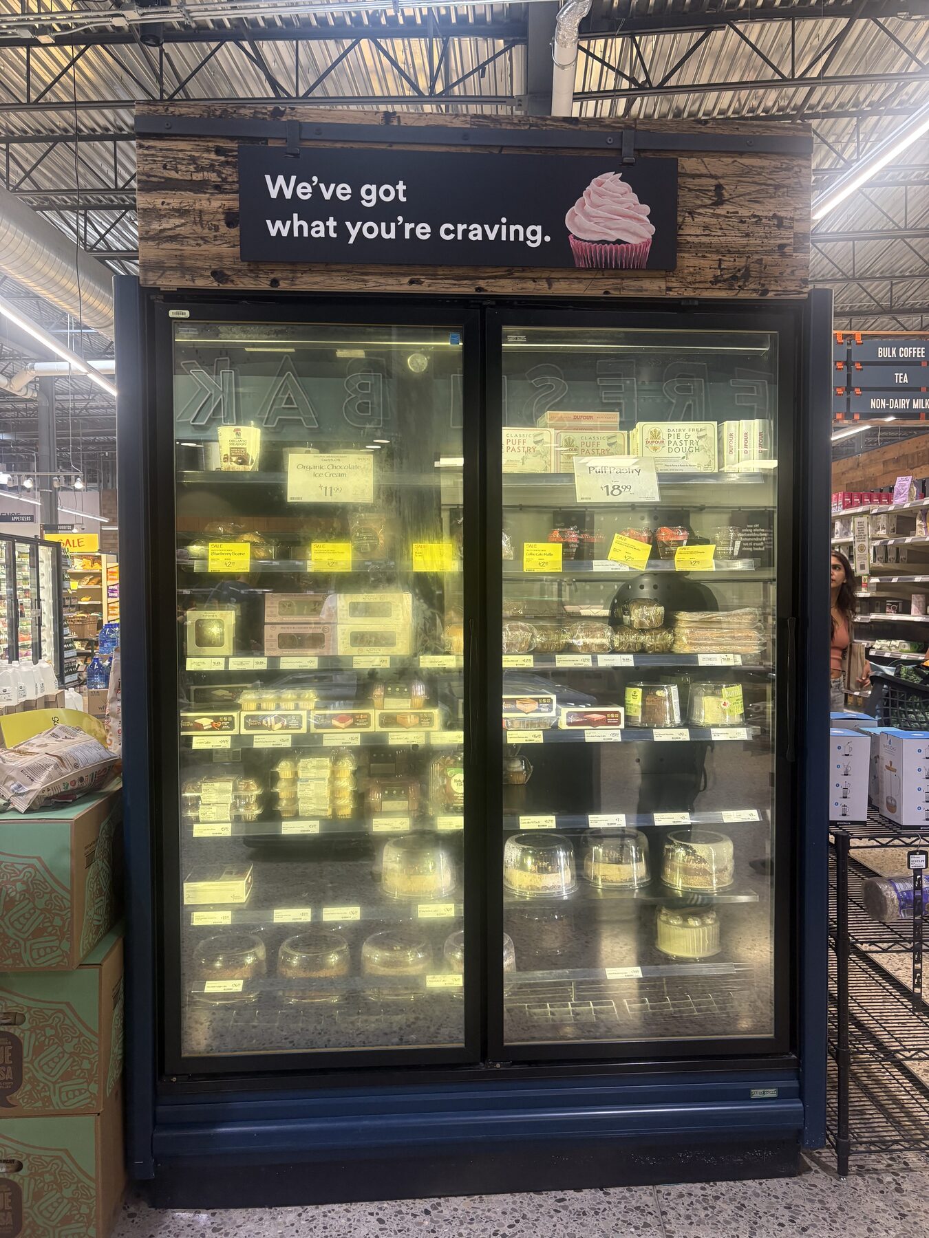 Craving-themed permanent sign installed above a freezer