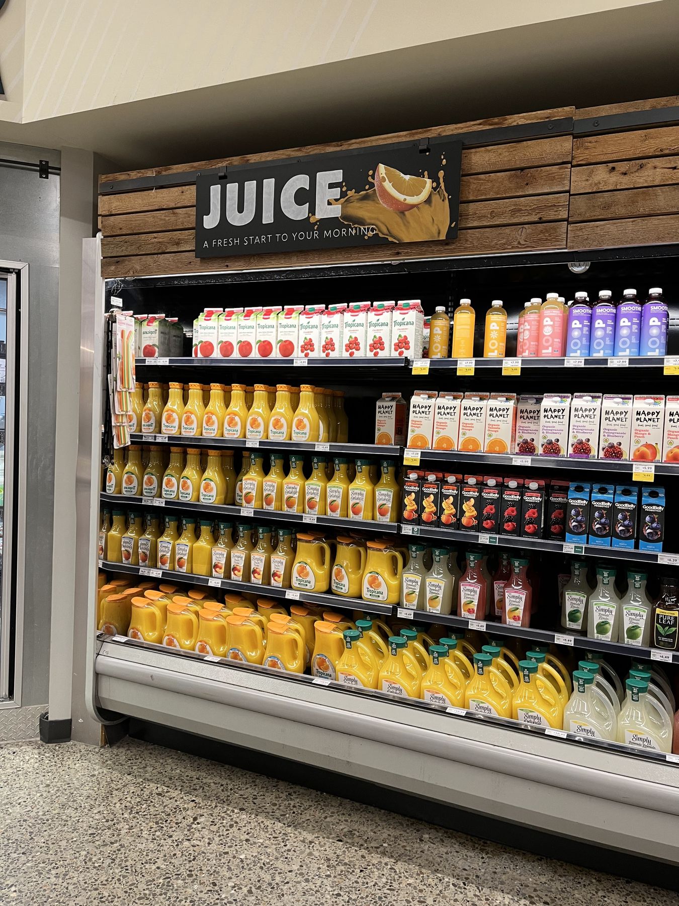 Illustrated Juice department sign in a retail space